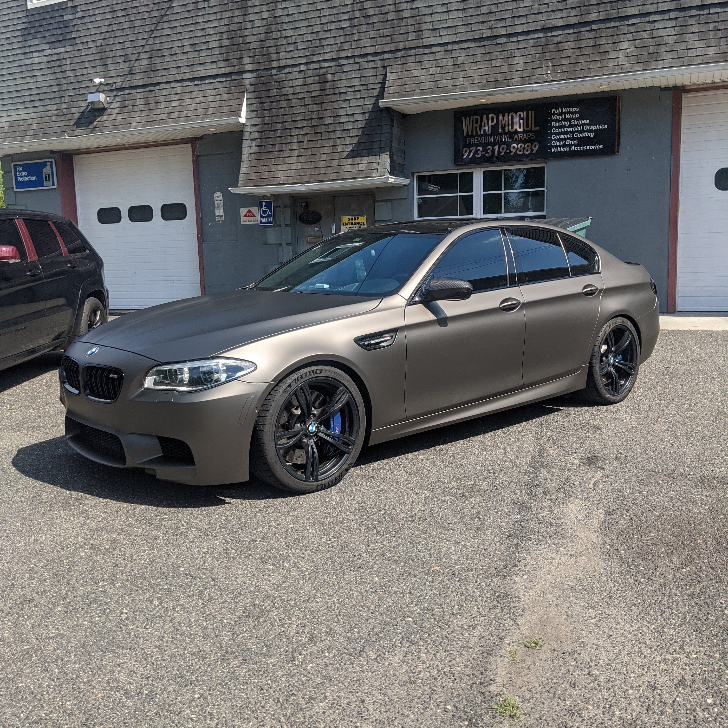BMW 5 Series vinyl wrap full vehicle charcoal color
