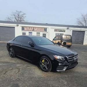 Black Mercedes with ceramic coating, paint correction, and yellow calipers by Wrap Mogul